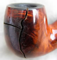 Damage caused to a briar smoking pipe bowl insufficiently reamed, possibly not reamed at all